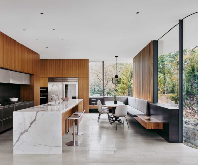 Open kitchen with marble island and timber joinery